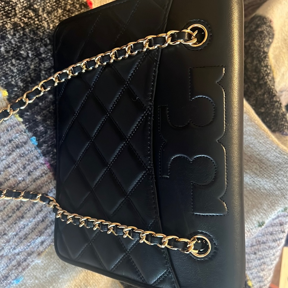 Beautiful Tory Burch convertible shoulder bag in black with gold chain.New
